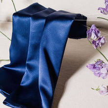 'Cloud 9' Night Sky Navy Blue Silk Pillowcase draped across foreground with purple flowers