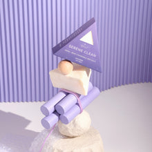 Moonlit Skincare Serene Clean Soap on top of a structure on purple ridged background