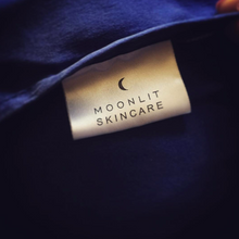Close-up of Moonlit Skincare tag sewn on to 'Cloud 9' pillowcase in Night Sky Navy.