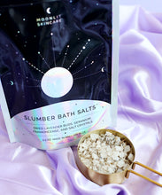 Slumber Bath Salts frankincense relaxing sleep with cup of bath salts on side on purple silk background
